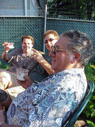 Three members of the Sciabica clan enjoy a drink and a cigar.